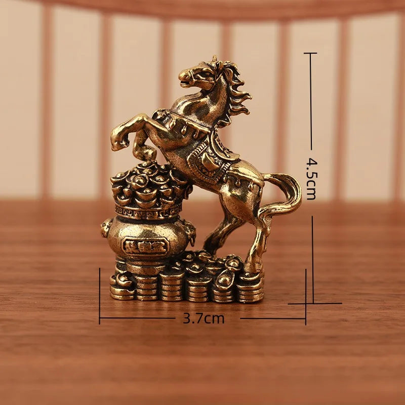 A solid copper figurine of a rearing horse with a lotus base, measuring 4.5cm tall.
