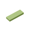 A rectangular, light green building brick tile.