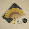 Traditional Bamboo Folding Fan with Solid Color Design