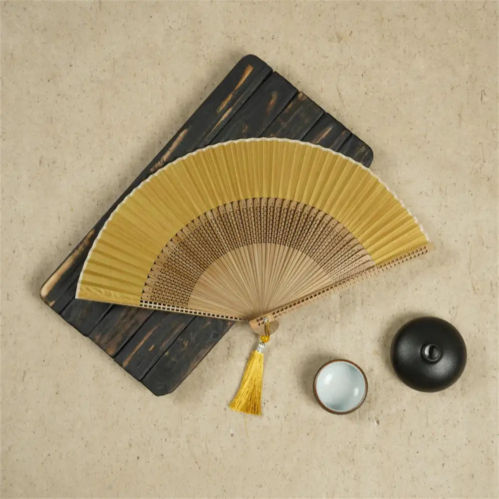 Traditional Bamboo Folding Fan with Solid Color Design