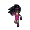 A sparkly pink woman with black curly hair and glasses wearing a pink dress, depicted as an enamel pin badge.