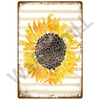 A vintage metal sign featuring a sunflower design with yellow and orange petals against a striped background.