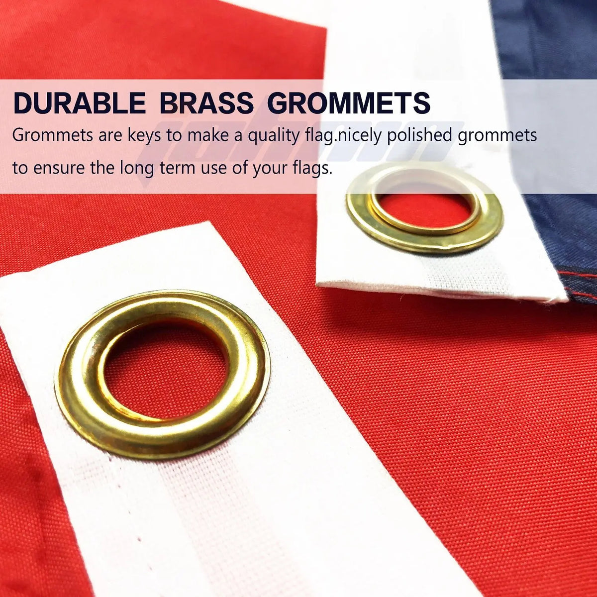 Close-up of polished brass grommets used for securing flags on a red and blue fabric banner.