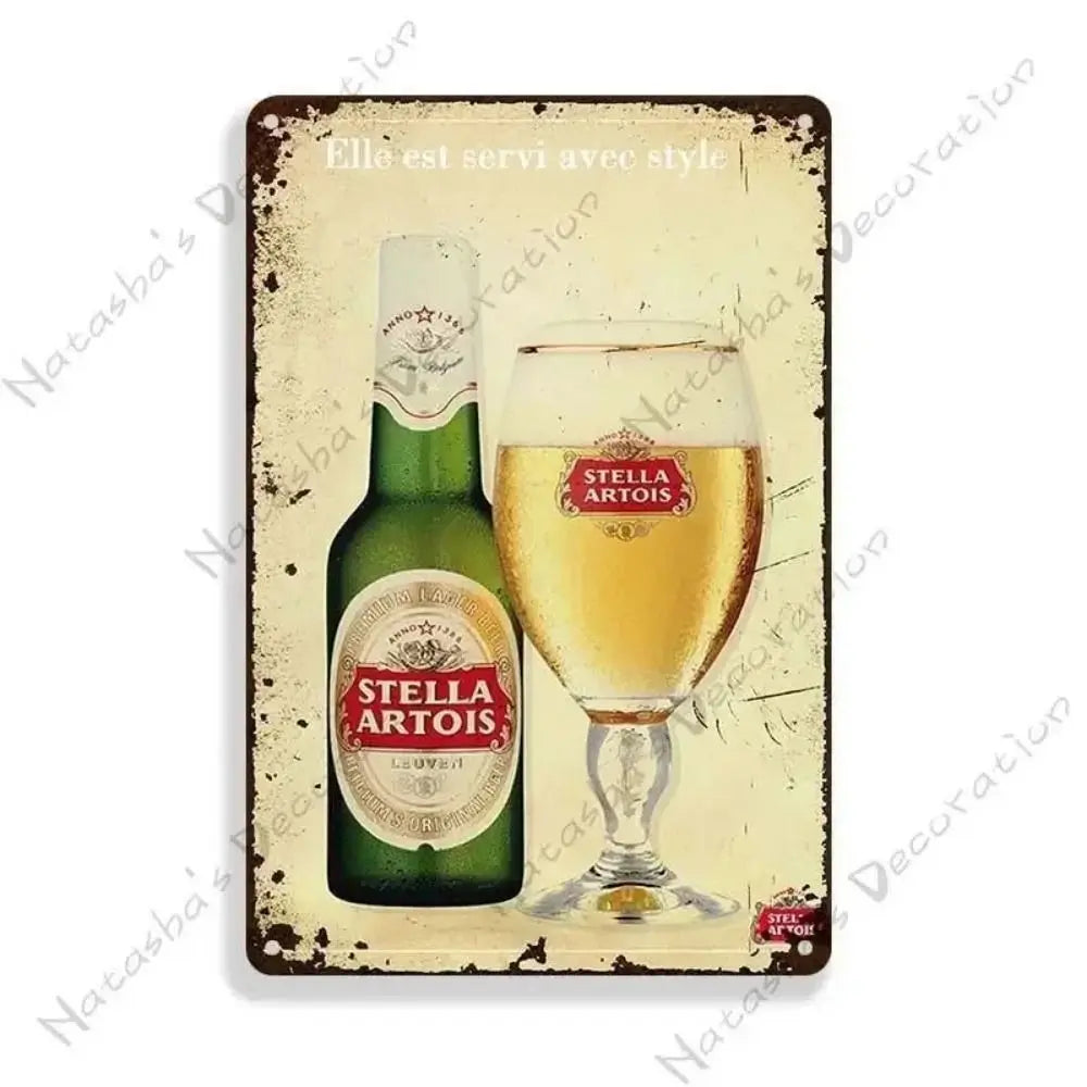 A vintage green bottle of Stella Artois beer displayed on a retro metal bar sign decoration.