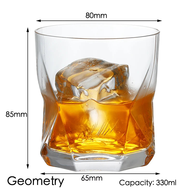 A clear whiskey glass filled with amber liquid and a large ice cube, showing its geometry and capacity.