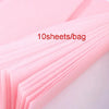 Pink tissue paper sheets stacked and folded, showing ten sheets per bag.