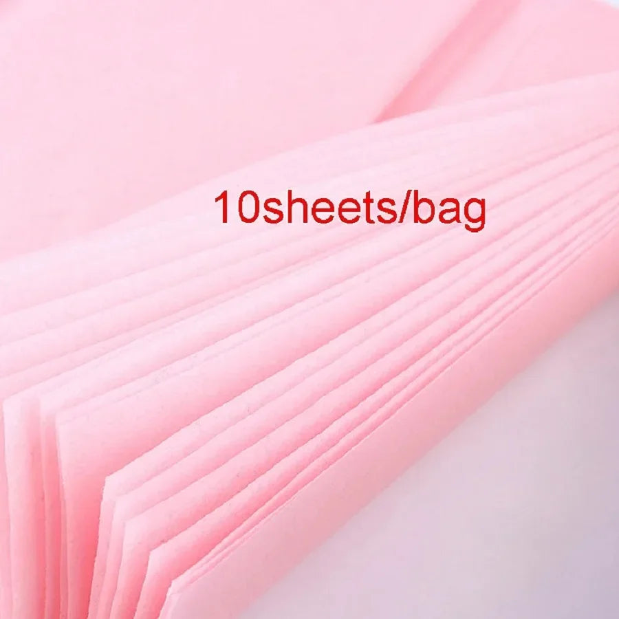 Pink tissue paper sheets stacked and folded, showing ten sheets per bag.