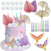 A set of mermaid cake toppers featuring pink and purple seashell and fish-like tail decorations.