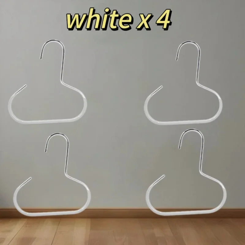 Four white hat organizer racks hanging on a light gray wall.