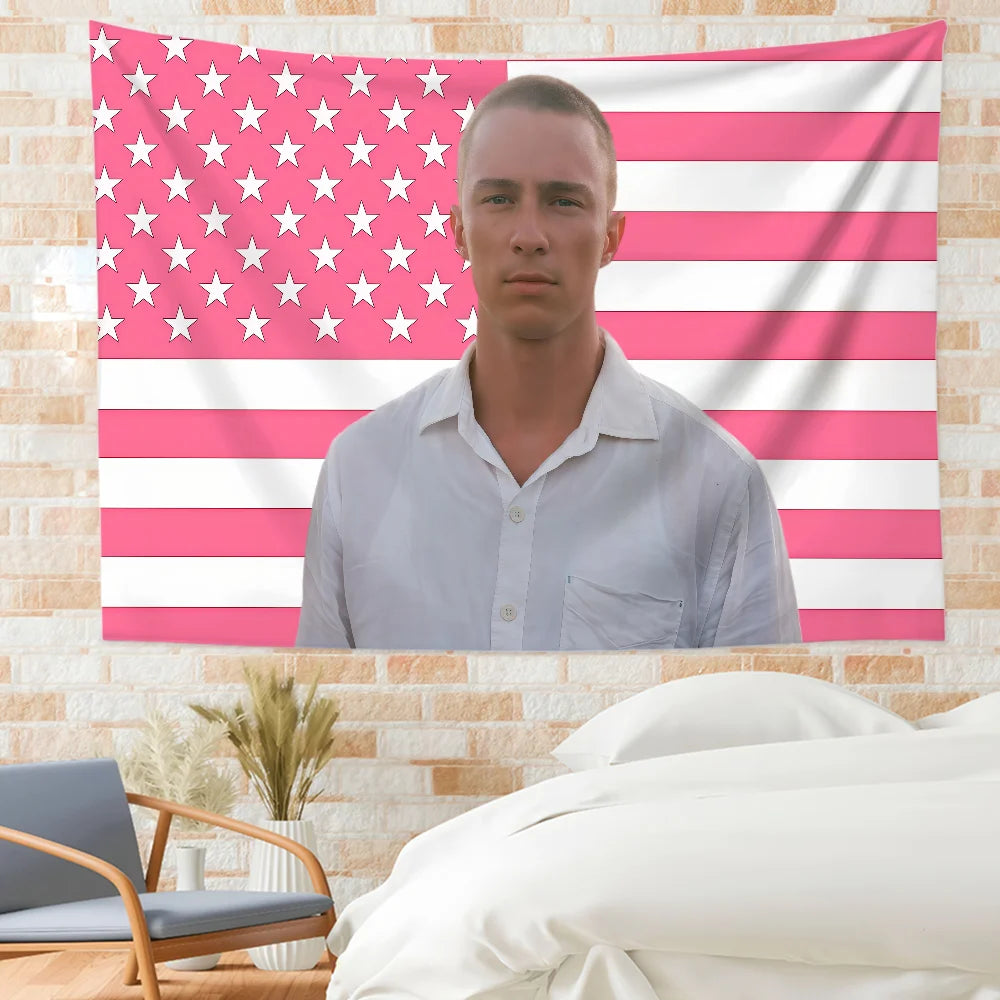 A wall tapestry featuring a patriotic American flag design with stars and stripes, displayed above a man wearing a light shir