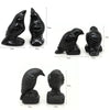 A collection of hand-carved black obsidian raven figurines shown with various dimensions.