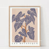 Wall art featuring a watercolor illustration of several purple philodendron leaves on a beige background.