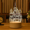A cutout acrylic night light shaped like an ornate mosque or cathedral, illuminated with a warm glow.