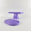 A purple cupcake stand with a scalloped top and a round purple stand for party decor.