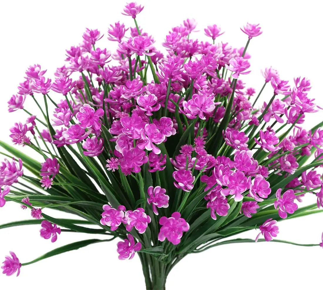 A bundle of vibrant purple pink artificial flowers used for home and event decoration.