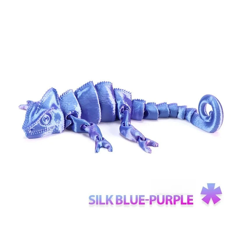A blue-purple articulated 3D printed dragon lizard figurine.