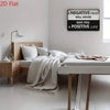 A motivational metal wall art sign with the quote Negative mind will never give you a positive life displayed above a wooden 