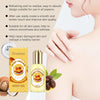 A bottle of OcéArra Sweet Caramel body oil next to its packaging and a person applying the oil to their skin.