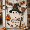 Wooden ghost door hanging featuring a witch hat design and an carved pumpkin.