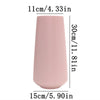 A tall, cylindrical pink ceramic vase with vertical ribbed texture.
