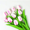A set of six pink and white artificial tulips with green stems displayed on a white background.