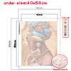 A paint by numbers kit showing a portrait of an African woman, with color codes and dimensions.
