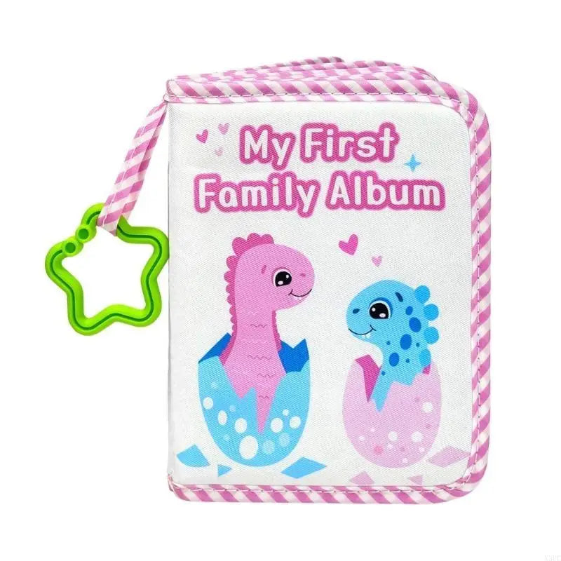 A pink and white striped cloth album featuring a purple dinosaur and a blue dinosaur, labeled My First Family Album.