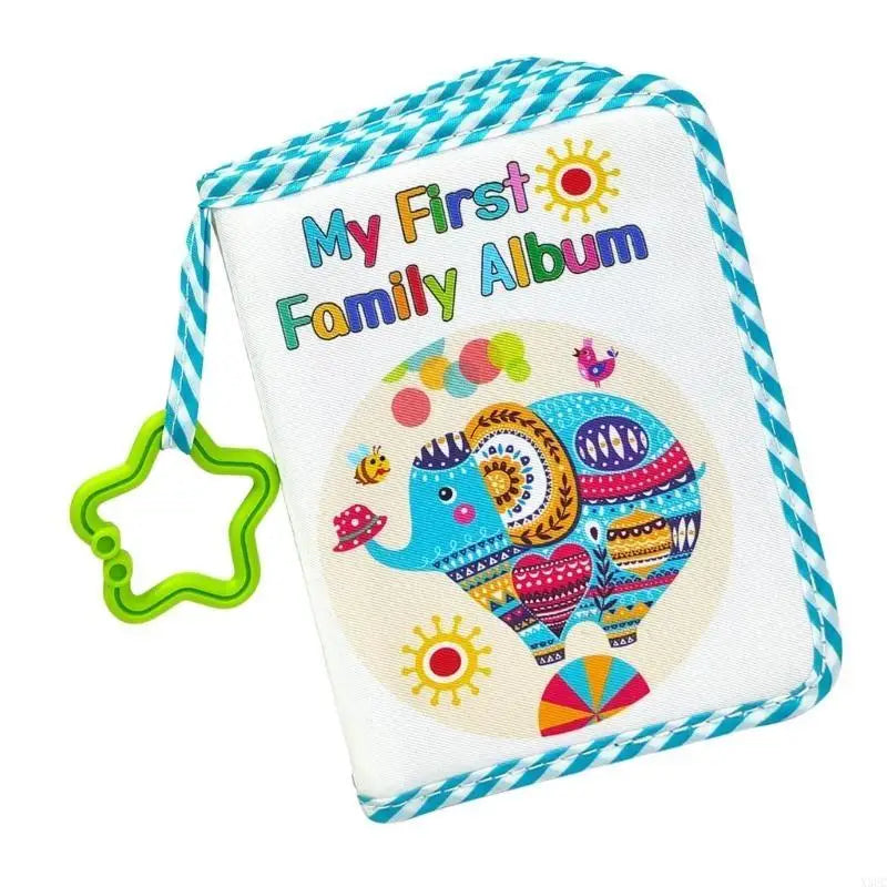 A soft cloth baby photo album featuring colorful illustrations of elephants and suns on a blue and white striped background.