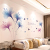 Wall stickers featuring watercolor-style pink and blue floral designs on a white wall.