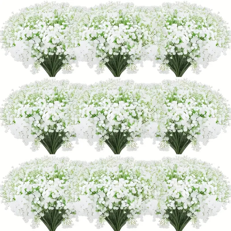 A display of white baby's breath artificial flowers arranged in bouquets.