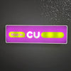 A rectangular sign with purple background featuring the text Nice to CU in yellow and white.