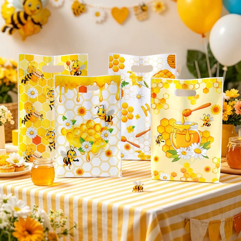 Yellow and white honeycomb patterned gift bags with handles filled with honey and flowers