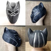 A realistic horror animal mask in black and silver tones displayed on a mannequin.