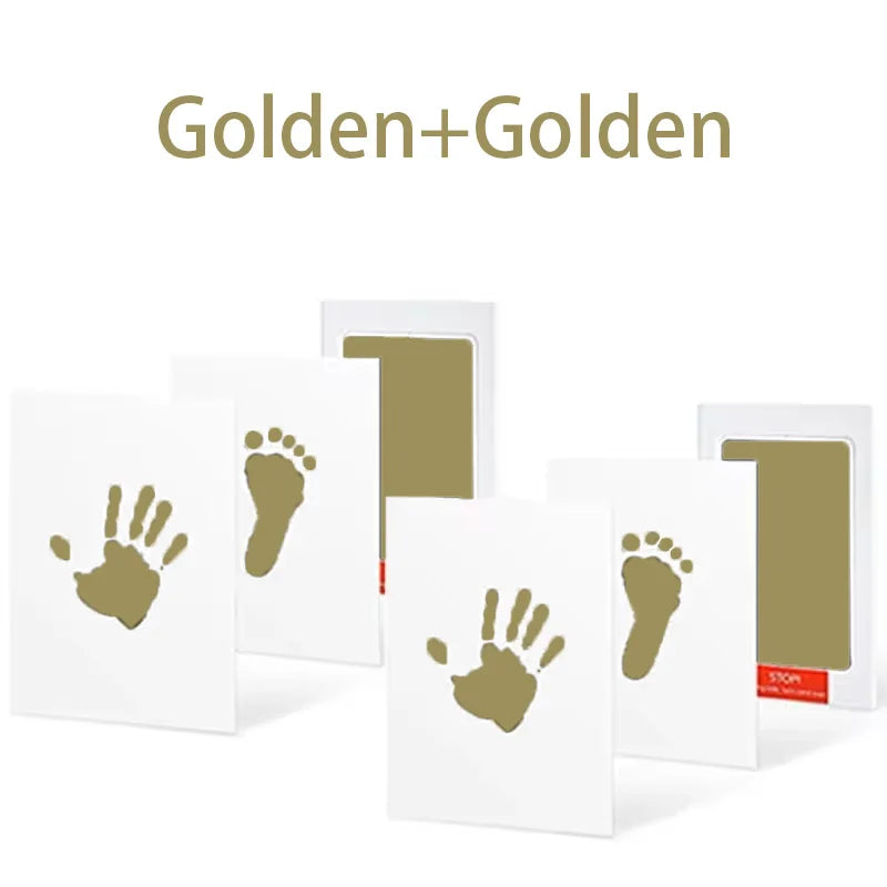 A set of Golden+Golden handprint and footprint ink pads on white cards.
