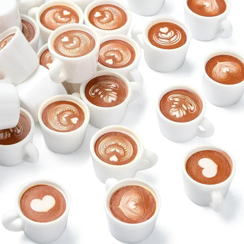 A collection of ten miniature white ceramic coffee mugs filled with latte art, arranged on a white background.