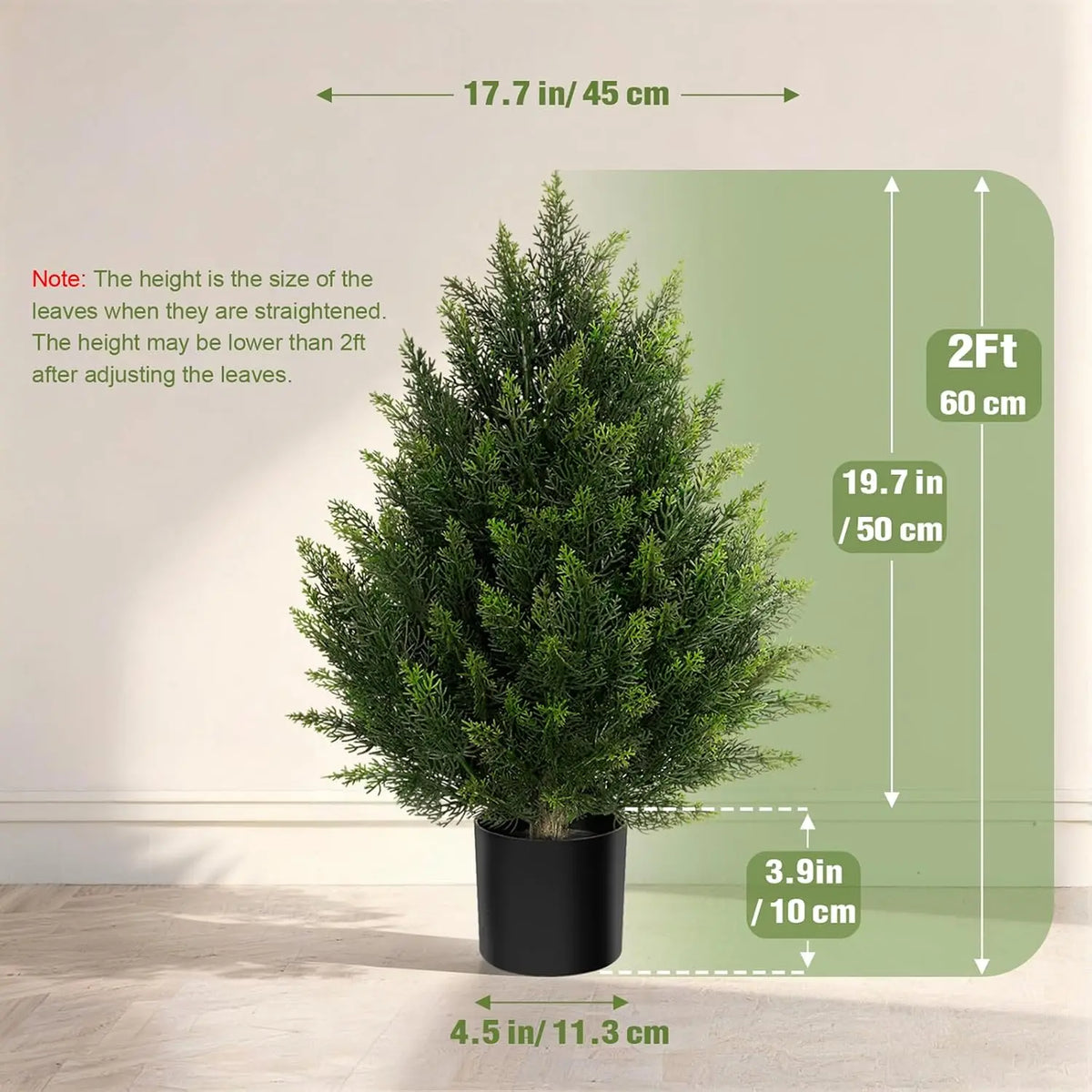 A small artificial cedar topiary tree in a black pot shown against a light background with dimension lines.