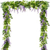 Green silk wisteria vine garland with purple flowers used as a wedding and home decor arch