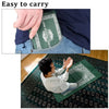 A hand is shown carrying a green pocket prayer mat with a compass inside a blue shirt.