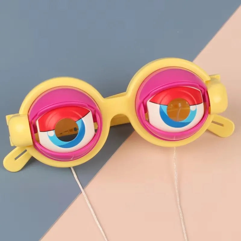 Yellow novelty glasses with pink and blue lenses displayed against a light background.