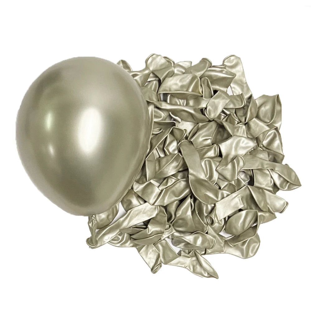 A single metallic silver latex balloon next to a pile of crumpled metallic silver foil balloons.