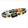 A bracelet made of polished, round crystals in various colors including red, yellow, green, and black.