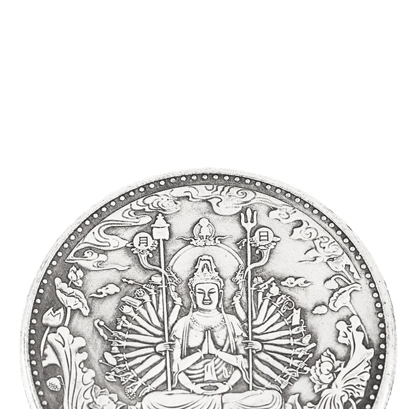 A detailed black and white illustration of a Tibetan Buddhist statue with multiple arms and ancient coins.
