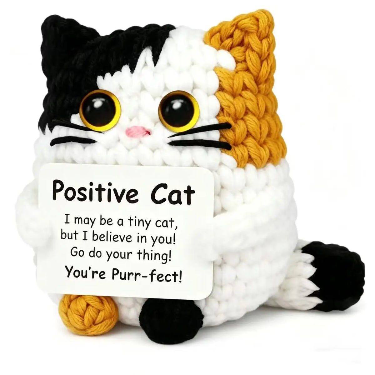 Handmade crochet cat doll with black and white fur and a yellow knitted bat, featuring a positivity card.