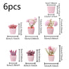 A set of six artificial pink potted plants in various sizes and shapes.