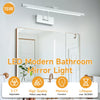 Modern LED bathroom mirror light featuring a long bar fixture and a large mirror.