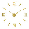 A gold-colored analog clock face with Roman numerals and golden hands against a white background.