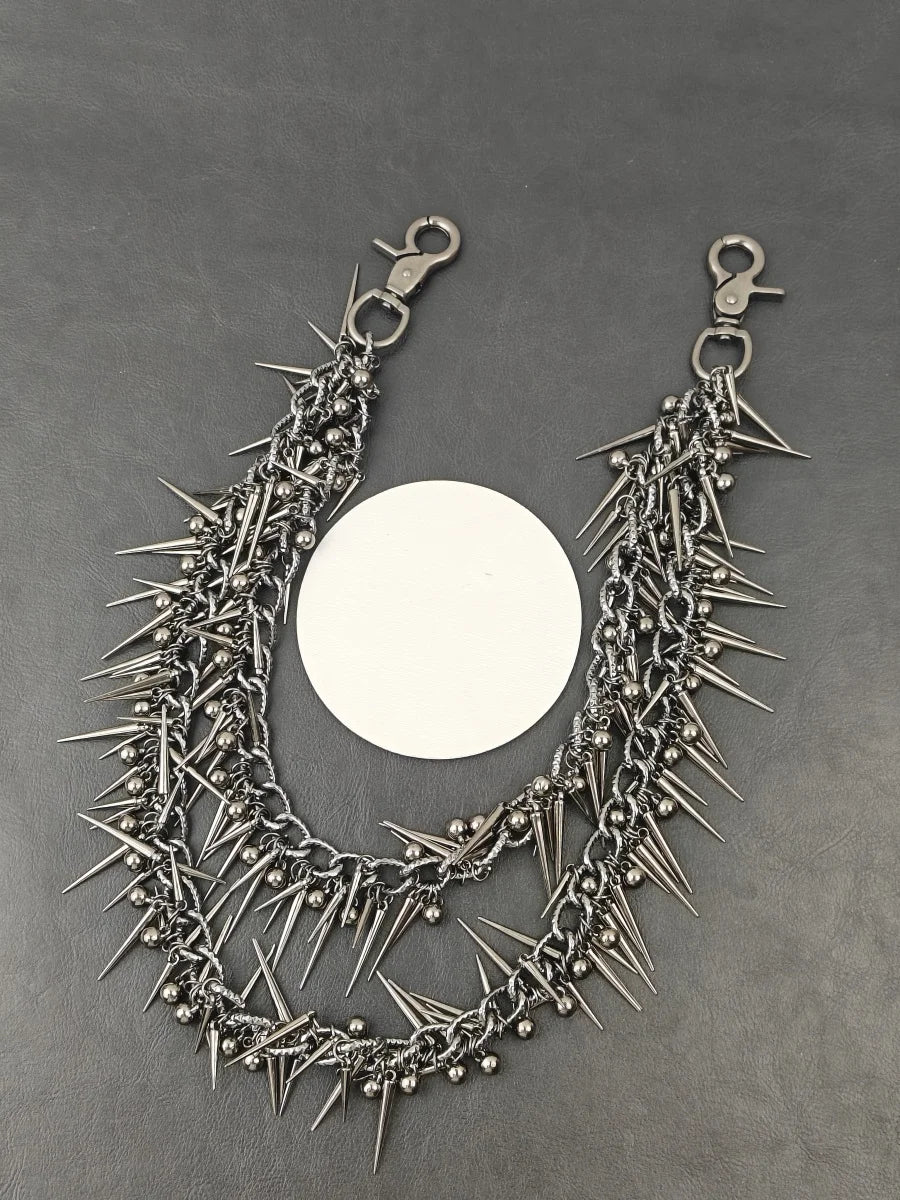 A heavy punk rivet biker style keychain featuring a chain of sharp metal spikes and rivets.