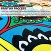 Close-up of a vibrant blue fabric featuring a colorful decorative print for a garden flag.