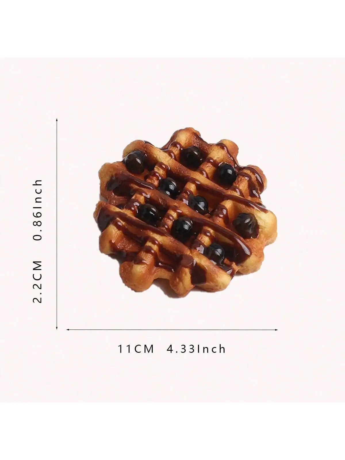 A golden brown waffle with dark syrup drizzled on it, shown against a white background.