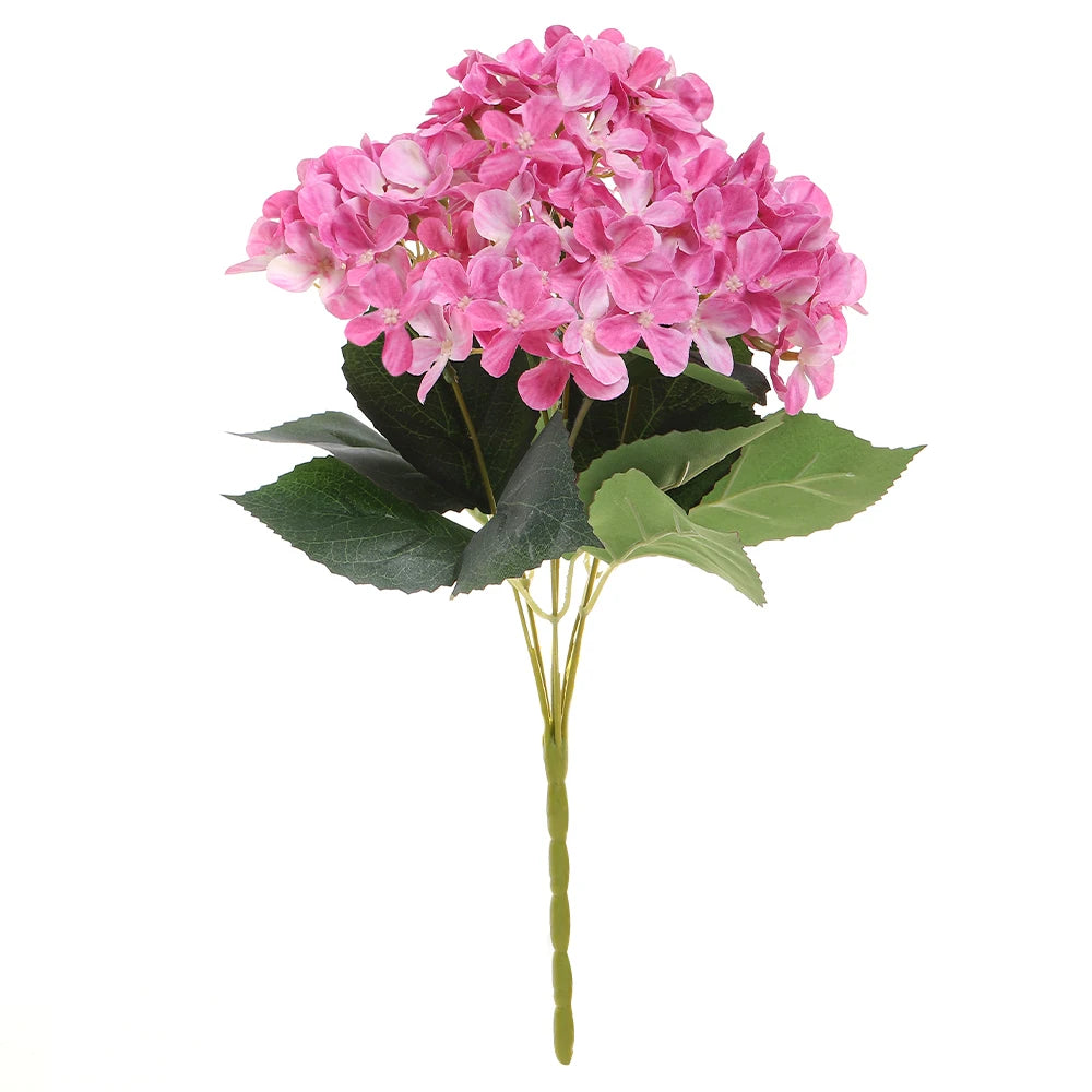 A bouquet of pink artificial hydrangea flowers with green leaves.